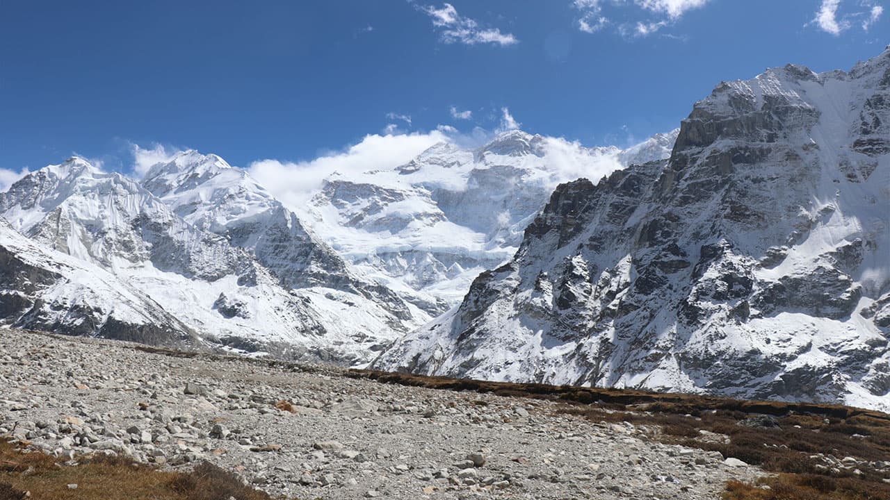 Panoramic view of snowy Kanchenjunga mountain range.