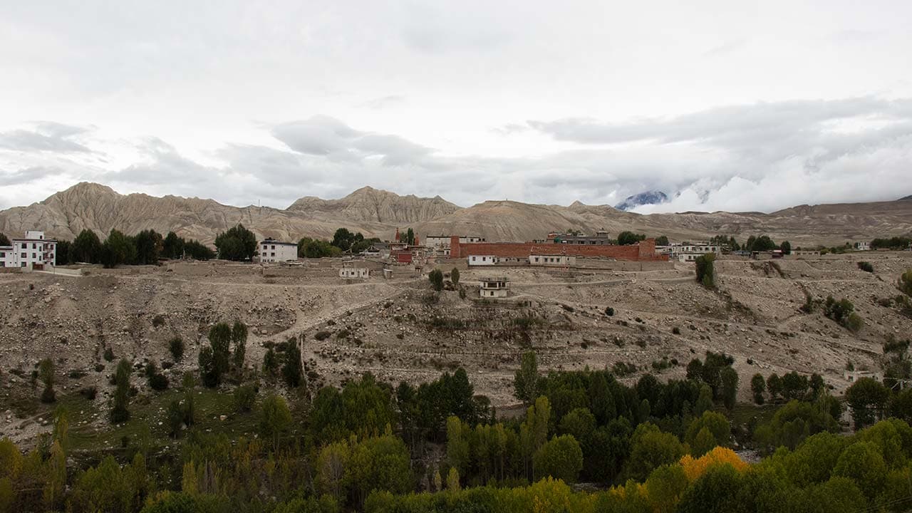 Traditional settlement of Tsarang surrounded by dry, eroded hills and dramatic landscapes during the 13 Days Upper Mustang Trek.