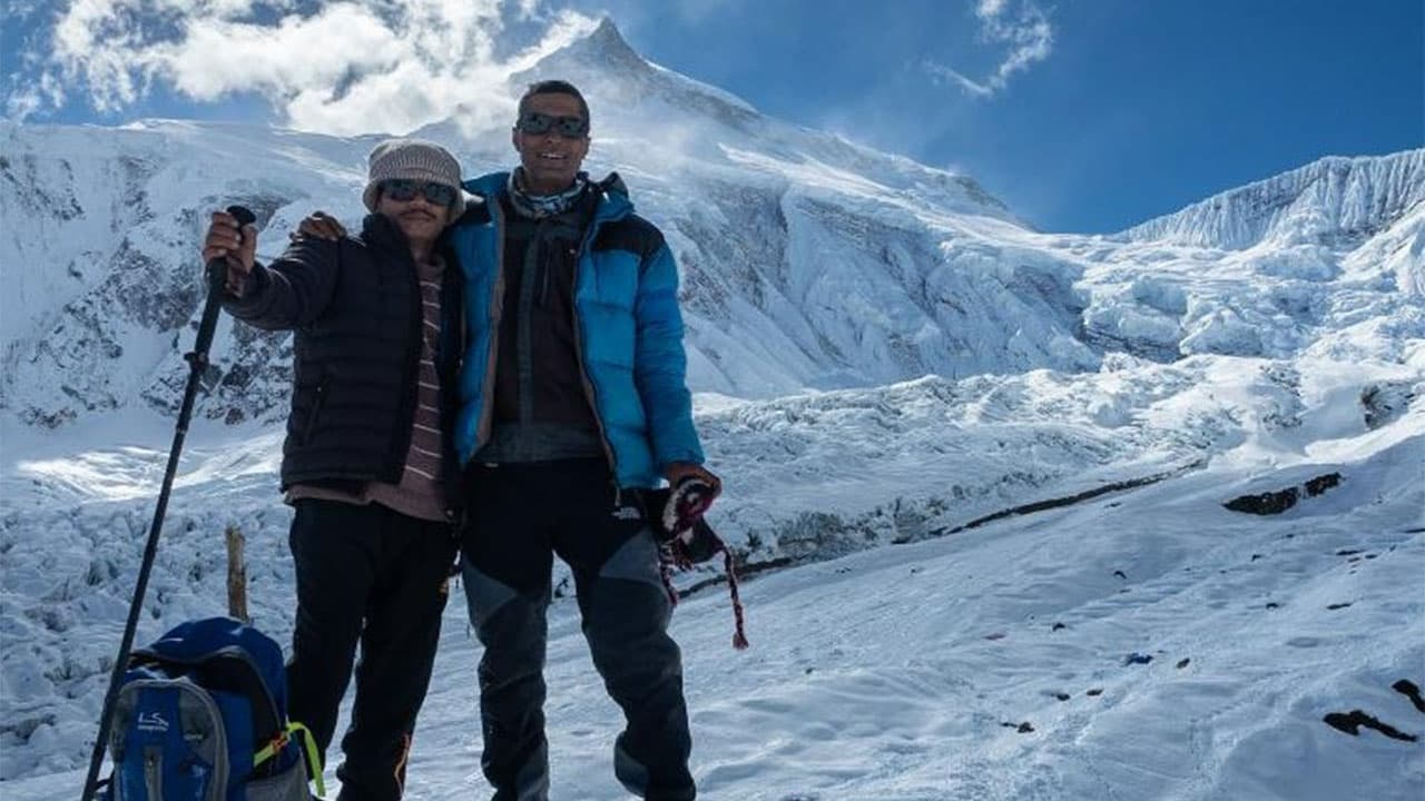 Trekkers at the Larkya La Pass (5,106m) summit during the 20 days Manaslu Circuit with Tsum Valley Trek.